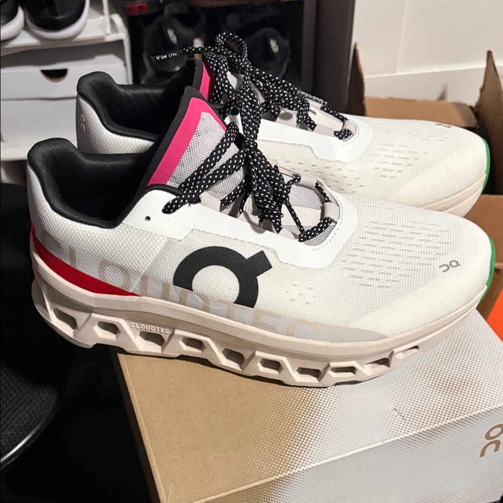 On Running White and Black Sneakers with Red Accents